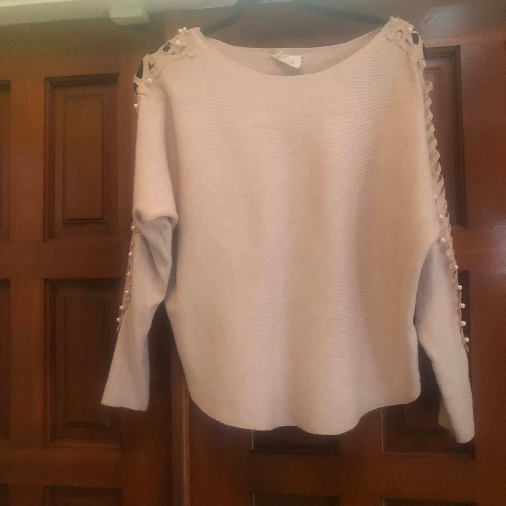 Woman light sweater, size large, color cream. Can be wear dressy or casual.